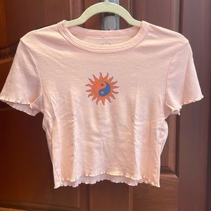 PacSun orange graphic cropped tee with lettuce trim. Yin yang sun symbol